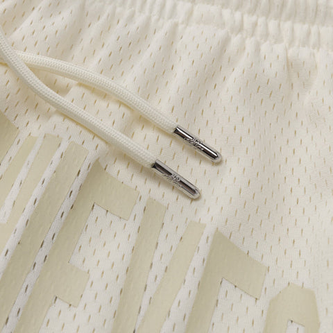 drawstring metal tip details on Foundations SS'24 Mesh Short - Cream