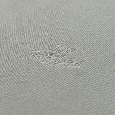 100 thieves logo detail on Foundations SS'24 Crewneck - Stonewash Green