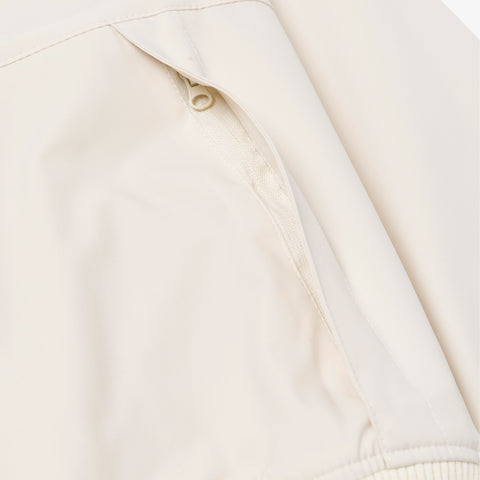 zipper detail on Foundations FW'24 Women's Windbreaker - Cream