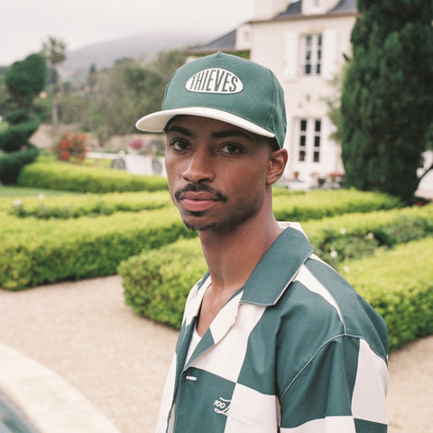 Model in Shakedown 5 Panel - Green/Crème