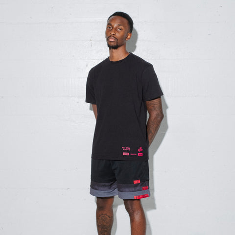 Model in 100T X Bristol Studio Triple Hem Shorts - Black