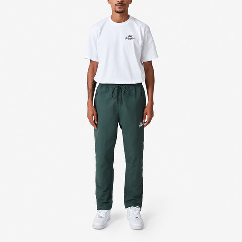 100 Thieves Foundation nylon pants with elastic waistband and 100 Thieves metal aglet tipped drawstrings in the color alpine