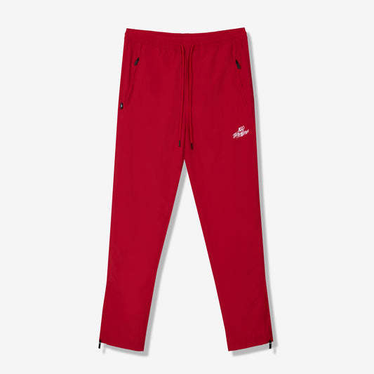 100 Thieves Foundation nylon pants with elastic waistband and 100 Thieves metal aglet tipped drawstrings in the color red